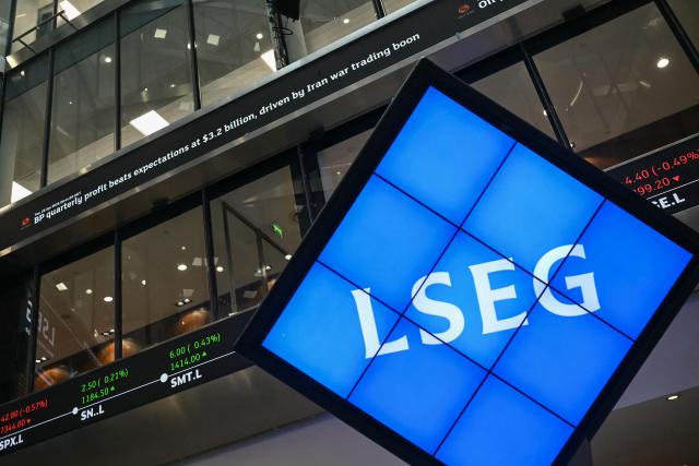 A stock ticker showing a headline reporting on British energy giant BP (top) is pictured at the London Stock Exchange Group (LSEG) offices in London on April 28, 2026. British energy giant BP on April 28 reported a sharp increase in profits in the first quarter as crude oil prices soared amid the Middle East war. (Photo by JUSTIN TALLIS / AFP)