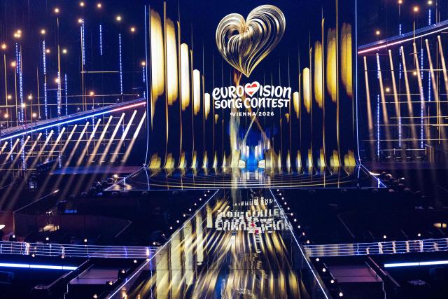 The lettering 'Eurovision Song Contest Vienna 2026' is seen during a light show as part of the official opening of the stage at the Wiener Stadthalle prior to the 70th Eurovision Song Contest (ESC), in Vienna, Austria on April 28, 2026. Vienna will host the two semi-finals of the ESC taking place on May 12 and May 14 and the final on May 16, 2026. (Photo by Joe Klamar / AFP)