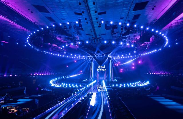 A light show and the lettering 'United by Music' are seen during the official opening of the stage for the ESC at the Wiener Stadthalle prior to the 70th Eurovision Song Contest (ESC), in Vienna, Austria on April 28, 2026. Vienna will host the two semi-finals of the ESC taking place on May 12 and May 14 and the final on May 16, 2026. (Photo by Joe Klamar / AFP)