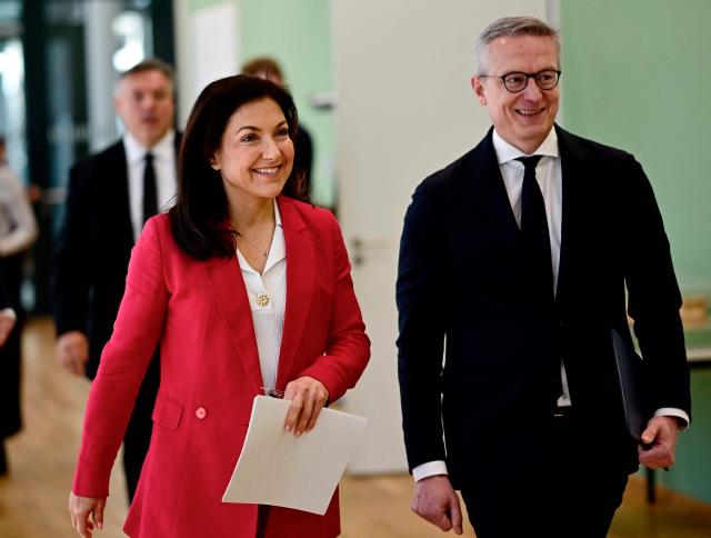 German Economy and Energy Minister Katherina Reiche and German Minister for Digitalization and State Modernization Karsten Wildberger arrive  to address a press conference on the conclusion of the expert commission 'Competition and Artificial Intelligence' in Berlin on April 28, 2026. (Photo by Tobias SCHWARZ / AFP)