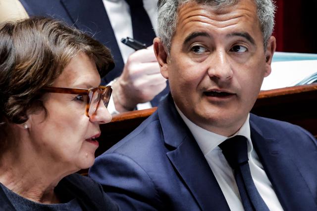 France's Agriculture Minister Annie Genevard (L) speaks with France's Justice Minister Gerald Darmanin (R) session of questions to the government at the National Assembly, French Parliament lower house, in Paris on April 28, 2026. (Photo by STEPHANE DE SAKUTIN / AFP)