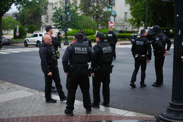 US Secret Service block a street near the White House before US President Donald Trump and First Lady Melania Trump greet Britain's King Charles III and Queen Camilla for an arrival ceremony on the South Lawn of the White House in Washington, DC, on April 28, 2026. (Photo by Aaron Schwartz / AFP)