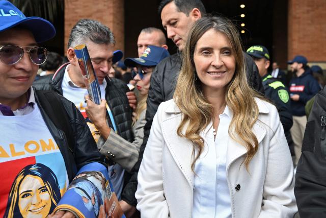 (FILES) Right wing presidential candidate for the Centro Democratico party, Paloma Valencia, arrives for a campaign rally in Bogota on March 26, 2026. Right-wing presidential candidate Paloma Valencia said on April 27 that Colombia’s government informed her of a plot to assassinate her, allegedly orchestrated by dissident FARC guerrillas responsible for deadly attacks against the civilian population over the weekend. (Photo by Daniel MUNOZ / AFP)