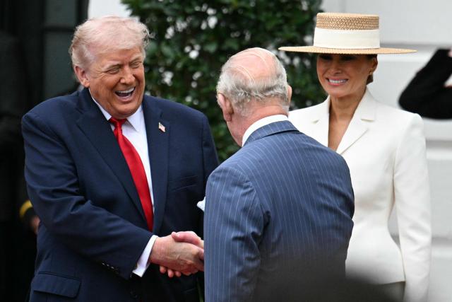US President Donald Trump and First Lady Melania Trump, greet Britain's King Charles III during an arrival ceremony on the South Lawn of the White House in Washington, DC, on April 28, 2026. (Photo by Jim WATSON / AFP)