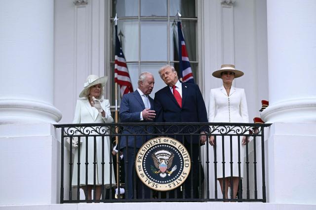 US President Donald Trump, First Lady Melania Trump, Britain's King Charles III and Queen Camilla pose on the White House balcony during an arrival ceremony on the South Lawn of the White House in Washington, DC, on April 28, 2026. (Photo by Brendan SMIALOWSKI / AFP)