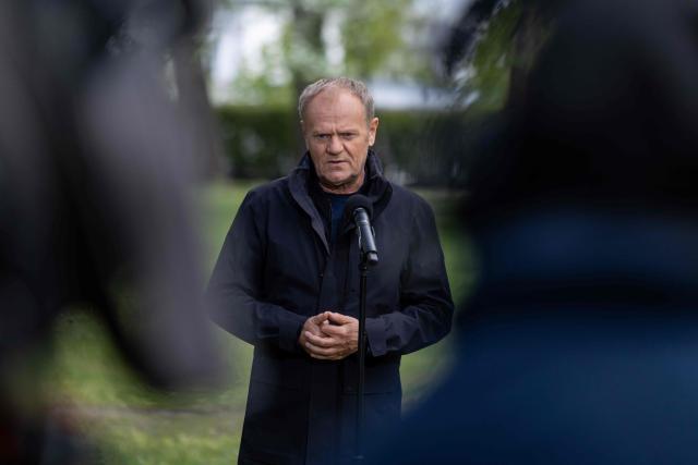Poland's Prime Minister Donald Tusk speaks during a press conference in front of the Chancellery in Warsaw on April 28, 2026, after a prisoner exchange. Poland on April 28 released a jailed Russian archaeologist, who was wanted by Ukraine, as part of a multi-country swap deal that also saw a Polish journalist freed from a Belarusian jail. (Photo by Wojtek RADWANSKI / AFP)