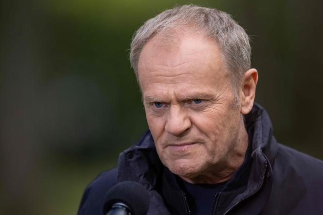 Poland's Prime Minister Donald Tusk speaks during a press conference in front of the Chancellery in Warsaw on April 28, 2026, after a prisoner exchange. Poland on April 28 released a jailed Russian archaeologist, who was wanted by Ukraine, as part of a multi-country swap deal that also saw a Polish journalist freed from a Belarusian jail. (Photo by Wojtek RADWANSKI / AFP)