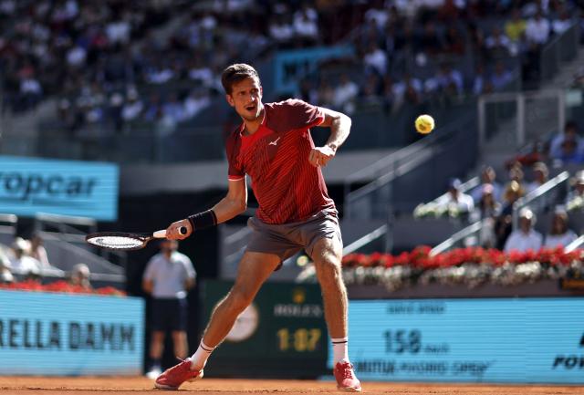 Czech Republic's Vit Kopriva returns the ball to Spain's Rafael Jodar during their 2026 ATP Tour Madrid Open tennis tournament singles match at the Caja Magica in Madrid, on April 28, 2026. (Photo by OSCAR DEL POZO / AFP)