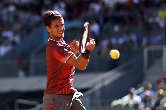 Czech Republic's Vit Kopriva returns the ball to Spain's Rafael Jodar during their 2026 ATP Tour Madrid Open tennis tournament singles match at the Caja Magica in Madrid, on April 28, 2026. (Photo by OSCAR DEL POZO / AFP)