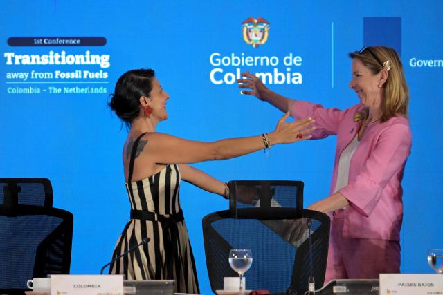 Dutch Minister of Climate and Green Growth Stientje van Veldhoven (R) and Colombia's Environment Minister Irene Velez greet during the International Conference on the Just Transition Away from Fossil Fuels in Santa Marta, Colombia, on April 28, 2026. (Photo by Raul ARBOLEDA / AFP)