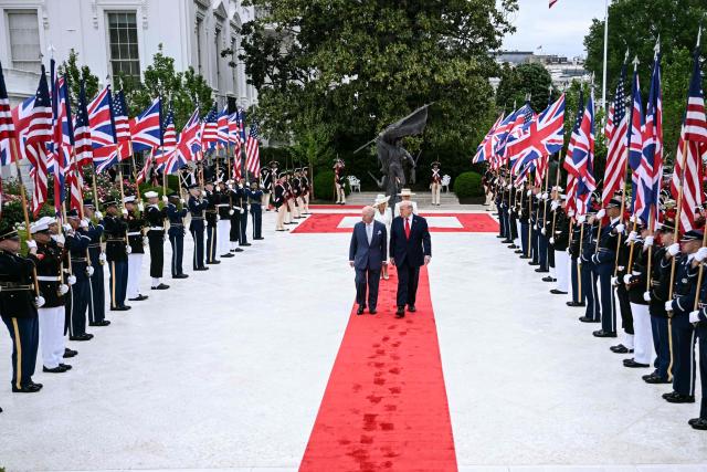 TOPSHOT - US President Donald Trump and Britain's King Charles III walk through the Rose Garden to the Oval Office of the White House in Washington, DC, on April 28, 2026. (Photo by Brendan SMIALOWSKI / AFP)