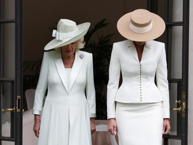First Lady Melania Trump (R) and Britain's Queen Camilla arrive to take part in a youth activity on the White House tennis court area in Washington, DC, on April 28, 2026. (Photo by Suzanne Plunkett / POOL / AFP)