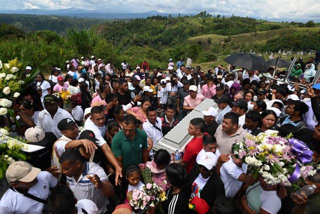 Mourners carry a coffin during the mass funeral for the victims of a highway bombing in Cajibio, Cauca department, Colombia on April 28, 2026. Colombia on April 27, 2026, was in mourning for the 21 victims of the country's deadliest bomb attack on civilians in decades, coming in the run-up to key elections. (Photo by JOAQUIN SARMIENTO / AFP)
