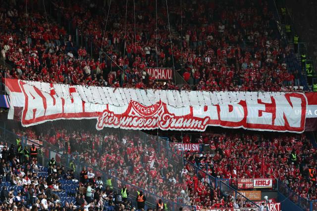 Bayern Munich's supporters cheer ahead of the UEFA Champions League semi-final first leg football match between Paris Saint-Germain (PSG) and Bayern Munich at the Parc des Princes in Paris on April 28, 2026. (Photo by FRANCK FIFE / AFP)