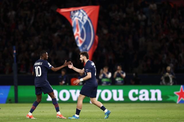 Paris Saint-Germain's Georgian forward #07 Khvicha Kvaratskhelia (R) celebrates with Paris Saint-Germain's French forward #10 Ousmane Dembele after scoring his team first goal during the UEFA Champions League semi-final first leg football match between Paris Saint-Germain (PSG) and Bayern Munich at the Parc des Princes in Paris on April 28, 2026. (Photo by FRANCK FIFE / AFP)