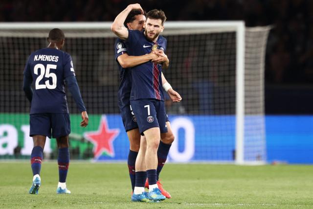 Paris Saint-Germain's Georgian forward #07 Khvicha Kvaratskhelia (R) celebrates with Paris Saint-Germain's Brazilian defender #05 Marquinhos after scoring his team first goal during the UEFA Champions League semi-final first leg football match between Paris Saint-Germain (PSG) and Bayern Munich at the Parc des Princes in Paris on April 28, 2026. (Photo by FRANCK FIFE / AFP)