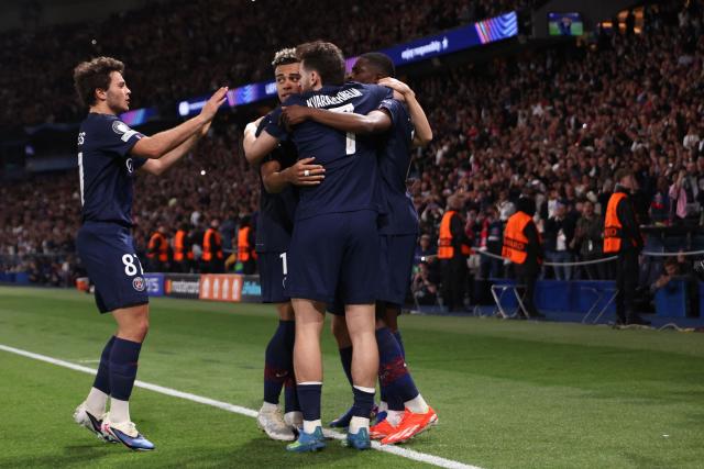 Paris Saint-Germain's French forward #10 Ousmane Dembele (R) celebrates with teammates after scoring his team third goal during the UEFA Champions League semi-final first leg football match between Paris Saint-Germain (PSG) and Bayern Munich at the Parc des Princes in Paris on April 28, 2026. (Photo by Franck FIFE / AFP)