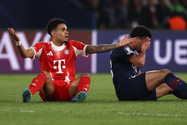 Bayern Munich's Colombian forward #14 Luis Diaz (L) reacts next to Paris Saint-Germain's French midfielder #33 Warren Zaire-Emery during the UEFA Champions League semi-final first leg football match between Paris Saint-Germain (PSG) and Bayern Munich at the Parc des Princes in Paris on April 28, 2026. (Photo by FRANCK FIFE / AFP)