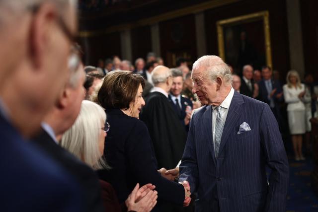 Britain's King Charles III greets US Senator Amy Klobuchar (D-MN) after addressing a Joint Meeting of Congress in the House Chamber at the US Capitol in Washington, DC, on April 28, 2026. (Photo by HENRY NICHOLLS / POOL / AFP)