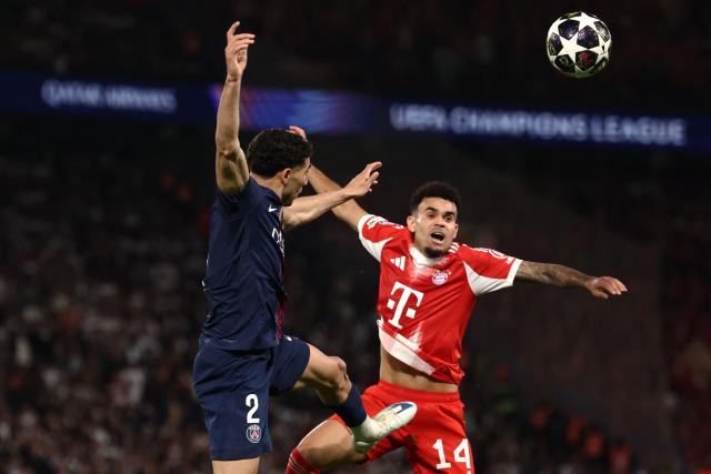 Paris Saint-Germain's Moroccan defender #02 Achraf Hakimi fights for the ball with Bayern Munich's Colombian forward Luis Diaz during the UEFA Champions League semi-final first leg football match between Paris Saint-Germain (PSG) and Bayern Munich at the Parc des Princes in Paris on April 28, 2026. (Photo by FRANCK FIFE / AFP)