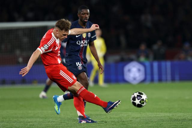 Bayern Munich's German midfielder #06 Joshua Kimmich fights for the ball with Paris Saint-Germain's French forward #10 Ousmane Dembele during the UEFA Champions League semi-final first leg football match between Paris Saint-Germain (PSG) and Bayern Munich at the Parc des Princes in Paris on April 28, 2026. (Photo by Anne-Christine POUJOULAT / AFP)