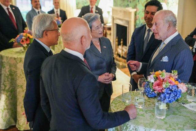 Britain's King Charles speaks with Nvidia CEO Jensen Huang, Amazon founder Jeff Bezos and AMD President Lisa Su during a meeting with chief executives from the technology industry at Blair House in in Washington, DC, on April 28, 2026. (Photo by Ken Cedeno / POOL / AFP)