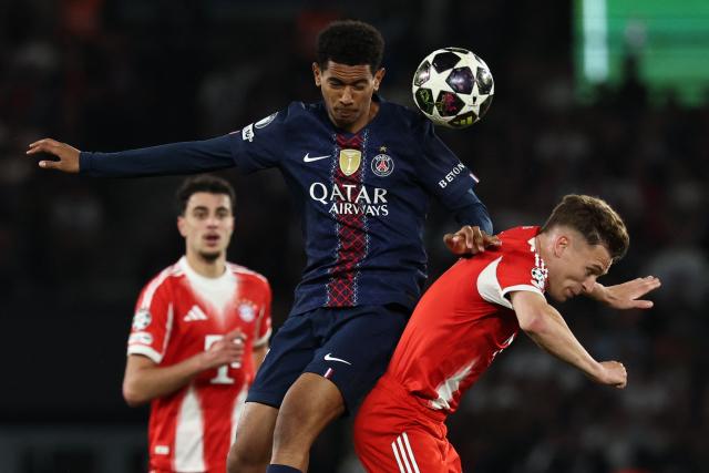 Paris Saint-Germain's French midfielder #24 Senny Mayulu (C) fights for the ball with Bayern Munich's German midfielder #06 Joshua Kimmich during the UEFA Champions League semi-final first leg football match between Paris Saint-Germain (PSG) and Bayern Munich at the Parc des Princes in Paris on April 28, 2026. (Photo by Anne-Christine POUJOULAT / AFP)