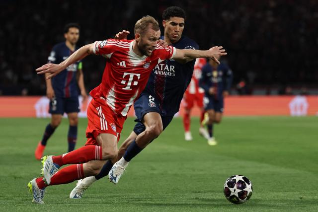 Bayern Munich's Austrian midfielder #27 Konrad Laimer fights for the ball with Paris Saint-Germain's Moroccan defender #02 Achraf Hakimi during the UEFA Champions League semi-final first leg football match between Paris Saint-Germain (PSG) and Bayern Munich at the Parc des Princes in Paris on April 28, 2026. (Photo by Anne-Christine POUJOULAT / AFP)