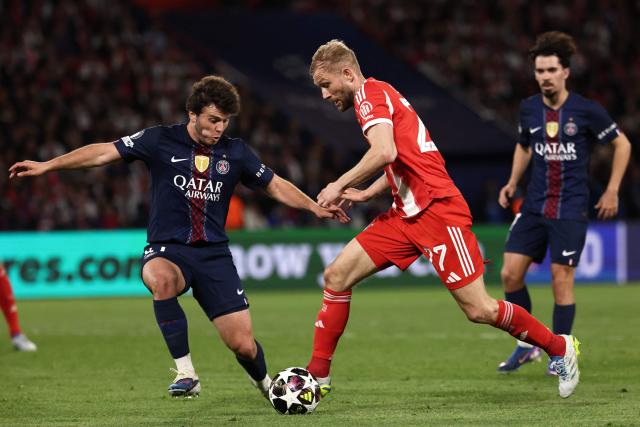 Paris Saint-Germain's Portuguese midfielder #87 Joao Neves fights for the ball with Bayern Munich's Austrian midfielder #27 Konrad Laimer during the UEFA Champions League semi-final first leg football match between Paris Saint-Germain (PSG) and Bayern Munich at the Parc des Princes in Paris on April 28, 2026. (Photo by FRANCK FIFE / AFP)