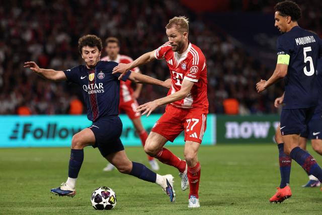 Paris Saint-Germain's Portuguese midfielder #87 Joao Neves fights for the ball with Bayern Munich's Austrian midfielder #27 Konrad Laimer during the UEFA Champions League semi-final first leg football match between Paris Saint-Germain (PSG) and Bayern Munich at the Parc des Princes in Paris on April 28, 2026. (Photo by FRANCK FIFE / AFP)