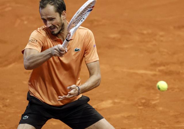 Russia's Daniil Medvedev returns the ball to Italy's Flavio Cobolli during their 2026 ATP Tour Madrid Open tennis tournament singles match at the Caja Magica in Madrid, on April 28, 2026. (Photo by OSCAR DEL POZO / AFP)