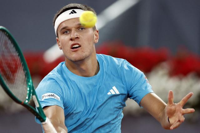 Czech Republic's Jakub Mensik returns the ball to Germany's Alexander Zverev during their 2026 ATP Tour Madrid Open tennis tournament singles match at the Caja Magica in Madrid, on April 28, 2026. (Photo by OSCAR DEL POZO / AFP)