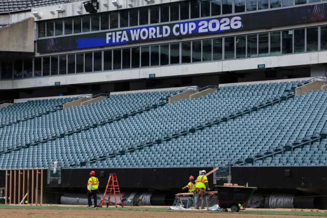 Workers prepare the field at Lincoln Financial Field, one of the stadium hosting the 2026 FIFA World Cup at Lincoln Financial Field in Philadelphia, on April 28, 2026. (Photo by ANGELA WEISS / AFP)
