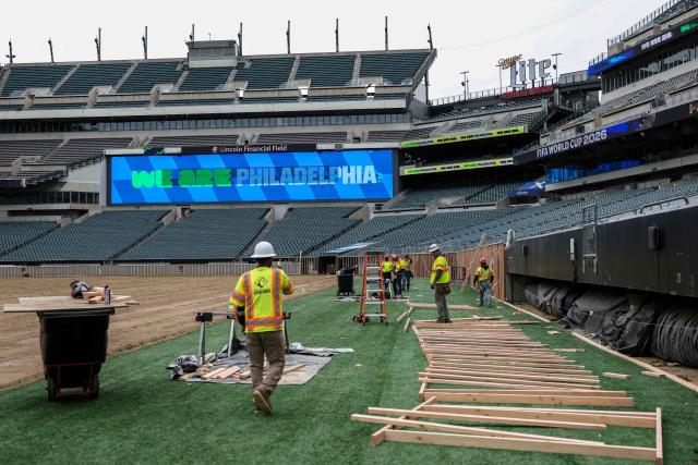 Workers prepare the field at Lincoln Financial Field, one of the stadiums hosting the 2026 FIFA World Cup at Lincoln Financial Field in Philadelphia, on April 28, 2026. (Photo by ANGELA WEISS / AFP)