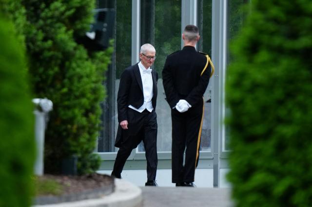 Apple CEO Tim Cook arrives for a State Dinner in the East Room of the White House in Washington, DC, on April 28, 2026. (Photo by Aaron Schwartz / AFP)