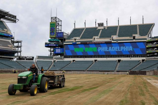 Workers prepare the field at Lincoln Financial Field, one of the stadiums hosting the 2026 FIFA World Cup at Lincoln Financial Field in Philadelphia, on April 28, 2026. (Photo by ANGELA WEISS / AFP)