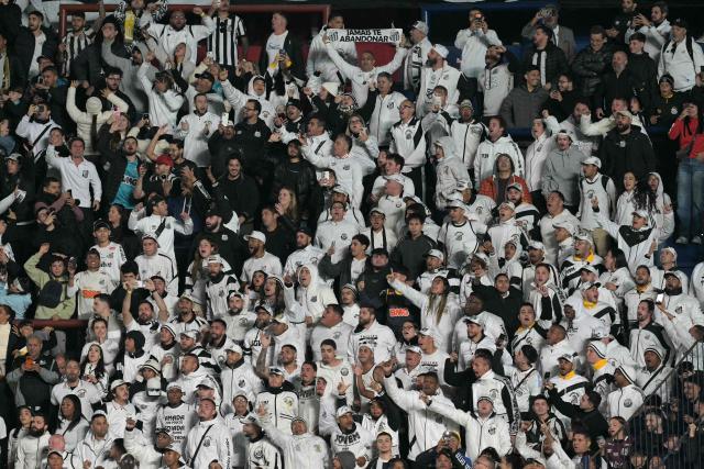 Santos fans cheer for their team before the Copa Sudamericana group stage football match between Argentina's San Lorenzo and Brazil's Santos at the Pedro Bidegain stadium in Buenos Aires on April 28, 2026. (Photo by JUAN MABROMATA / AFP)
