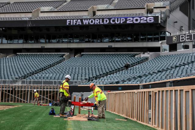 Workers prepare the field at Lincoln Financial Field, one of the stadiums hosting the 2026 FIFA World Cup at Lincoln Financial Field in Philadelphia, on April 28, 2026. (Photo by ANGELA WEISS / AFP)