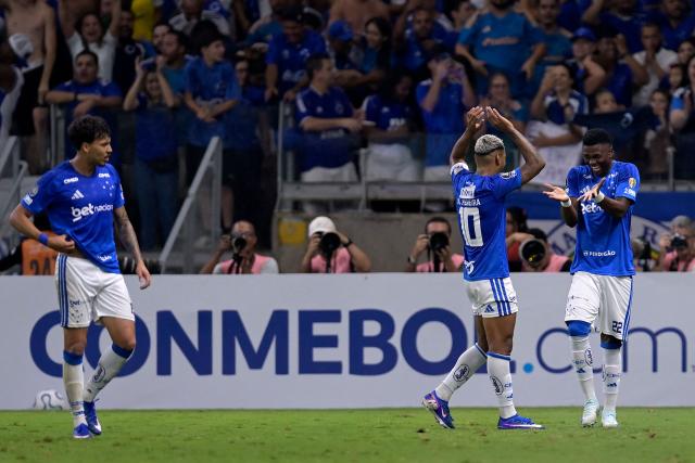 Cruzeiro's Colombian midfielder #22 Neyser Villareal (R) celebrates with teammate midfielder #10 Matheus Pereira after scoring during the Copa Libertadores group stage football match between Brazil's Cruzeiro and Argentina's Boca Juniors at the Mineirao stadium in Belo Horizonte, state of Minas Gerais, Brazil on April 28, 2026. (Photo by DOUGLAS MAGNO / AFP)