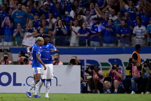 Cruzeiro's Colombian midfielder #22 Neyser Villareal (R) celebrates with teammate midfielder #10 Matheus Pereira after scoring during the Copa Libertadores group stage football match between Brazil's Cruzeiro and Argentina's Boca Juniors at the Mineirao stadium in Belo Horizonte, state of Minas Gerais, Brazil on April 28, 2026. (Photo by DOUGLAS MAGNO / AFP)