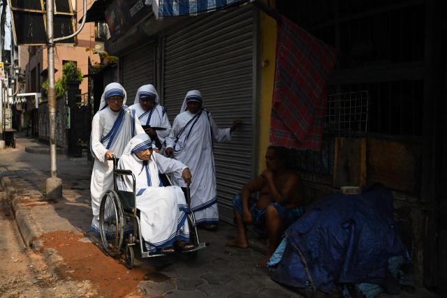 Nuns from Missionaries of Charity arrive to cast their votes for West Bengal state legislative assembly elections inside a polling station in Kolkata on April 29, 2026. (Photo by Dibyangshu SARKAR / AFP)