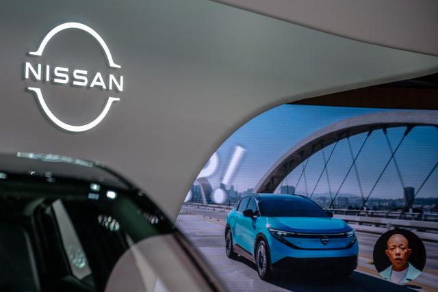 The logo of Japanese automaker Nissan is seen at a showroom in Tokyo's Ginza district on April 28, 2026. (Photo by Philip FONG / AFP)