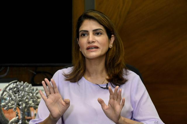 This photograph taken on April 7, 2026 shows Sara Saeed Khurram, a doctor and chief executive officer of digital health firm Sehat Kahani, speaking during an interview with AFP inside her office in Karachi. Gallup surveys and doctors' associations suggest more than a third of Pakistani female medical graduates never enter the profession -- or leave it after marriage -- due to lack of family support, poor childcare facilities, and harassment. But an initiative by digital health firm Sehat Kahani helped women back into the workforce by providing a digital platform to connect home-based, mostly female doctors, with patients in underserved communities. (Photo by Rizwan TABASSUM / AFP)