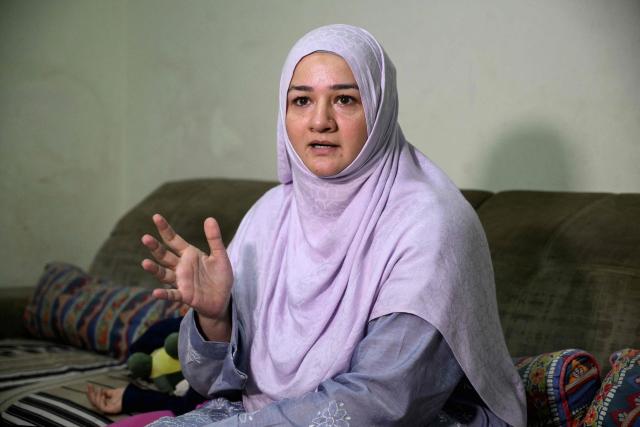 This photograph taken on April 7, 2026 shows Saniya Jafri, a doctor and telemedicine practitioner with the digital health firm Sehat Kahani, speaking during an interview with AFP at her residence in Karachi. Gallup surveys and doctors' associations suggest more than a third of Pakistani female medical graduates never enter the profession -- or leave it after marriage -- due to lack of family support, poor childcare facilities, and harassment. But an initiative by digital health firm Sehat Kahani helped women back into the workforce by providing a digital platform to connect home-based, mostly female doctors, with patients in underserved communities. (Photo by Rizwan TABASSUM / AFP)
