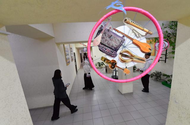 Pupils walk in a school's hallway in the northwestern village of Bukara, some 100 km from the Kyrgyz capital of Bishkek, on February 6, 2026. (Photo by Vyacheslav OSELEDKO / AFP)