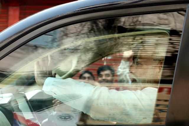 India's Prime Minister Narendra Modi waves to supporters as he leaves after seeking blessings from Kashi Vishwanath Temple in Varanasi on April 29, 2026. (Photo by Niharika KULKARNI / AFP)