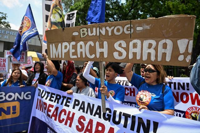 Protesters call for the impeachment of Philippine Vice President Sara Duterte outside the House of Representatives in Quezon City, Metro Manila on April 29, 2026. (Photo by Jam STA ROSA / AFP)