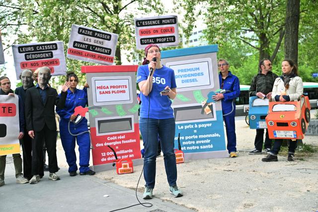 France Team Leader of 350.org NGO Fanny Petitbon speaks at the start of a staged protest action called by 350.org, Action Justice Climat, Attac France, Greenpeace France and Extinction Rebellion France against French company TotalEnergies marking the publication of its first-quarter results in Paris on April 29, 2026. French oil and gas giant TotalEnergies reported on April 29, 2026, a first-quarter net profit of $5.8 billion, up by nearly 50% year-on-year, driven by rising oil prices linked to the war in the Middle East. (Photo by Martin LELIEVRE / AFP)