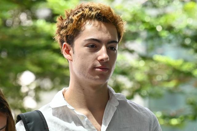 French teenager Didier Gaspard Owen Maximilien arrives for an application to leave jurisdiction, for the court's permission to leave Singapore, at the State Courts in Singapore on April 29, 2026. A French teenager has been charged with mischief and public nuisance in Singapore for licking a straw and putting it back in an orange juice vending machine, court documents showed April 27. (Photo by Roslan RAHMAN / AFP)