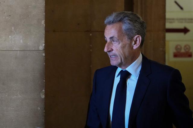 France's former President Nicolas Sarkozy arrives for his final hearing in his appeal trial over charges he had sought Libyan financing for his 2007 election in exchange for helping improve Tripoli's image after deadly bombing, at the Palais de Justice courthouse in Paris on April 29, 2026. (Photo by Dimitar DILKOFF / AFP)